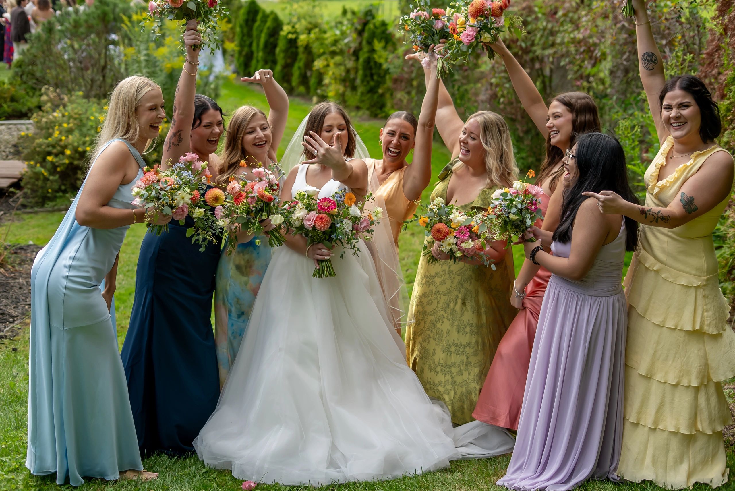 Bridal party celebrating in garden